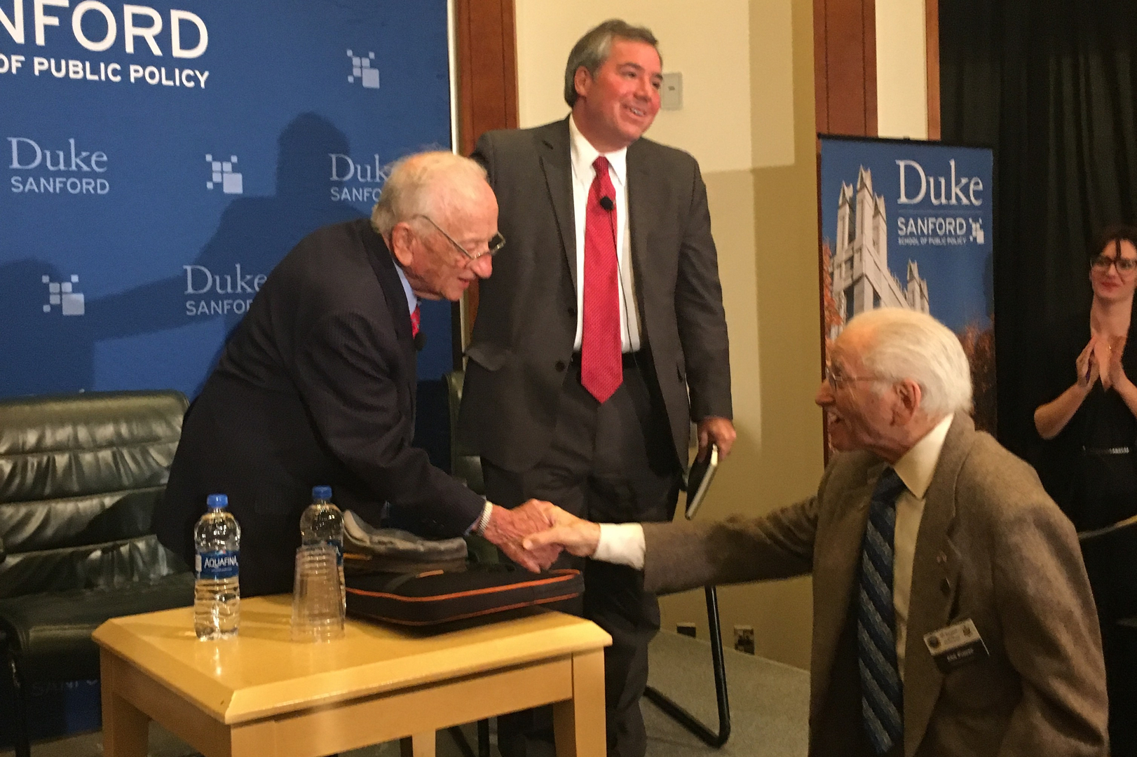 Local Holocaust survivor, Abe Piasek (on right) shakes hands with Ben Ferencz, Nuremberg trial prosecutor