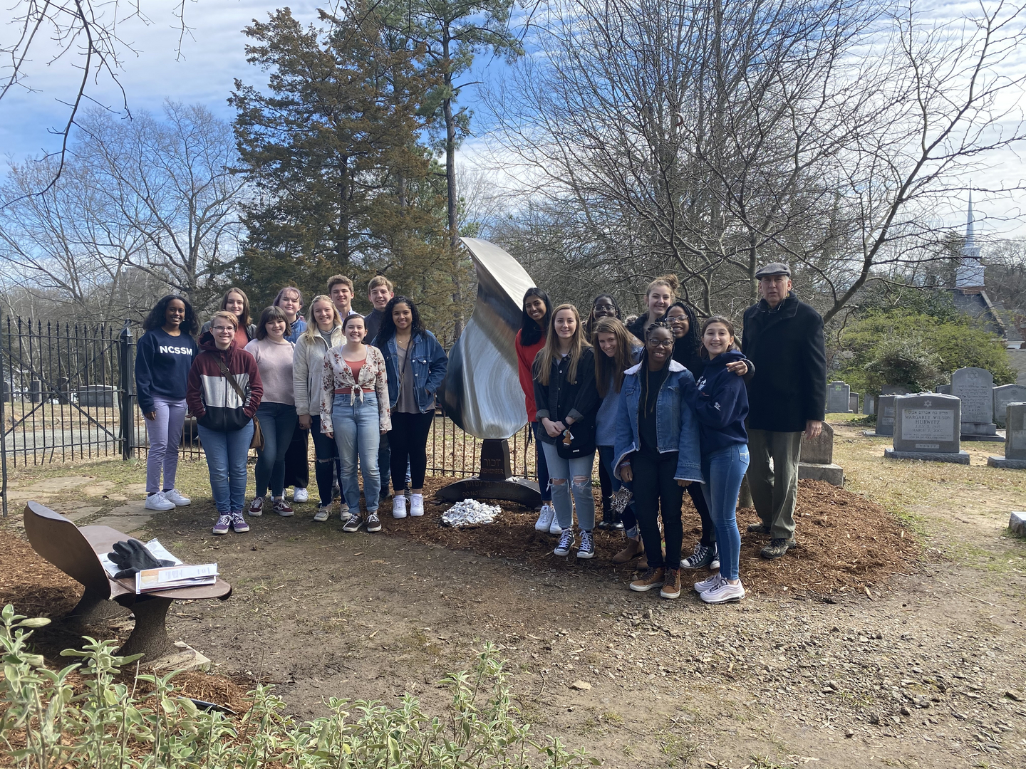 Ed Halperin and students from the NC School of Science and Math at the Dachau ashes monument
